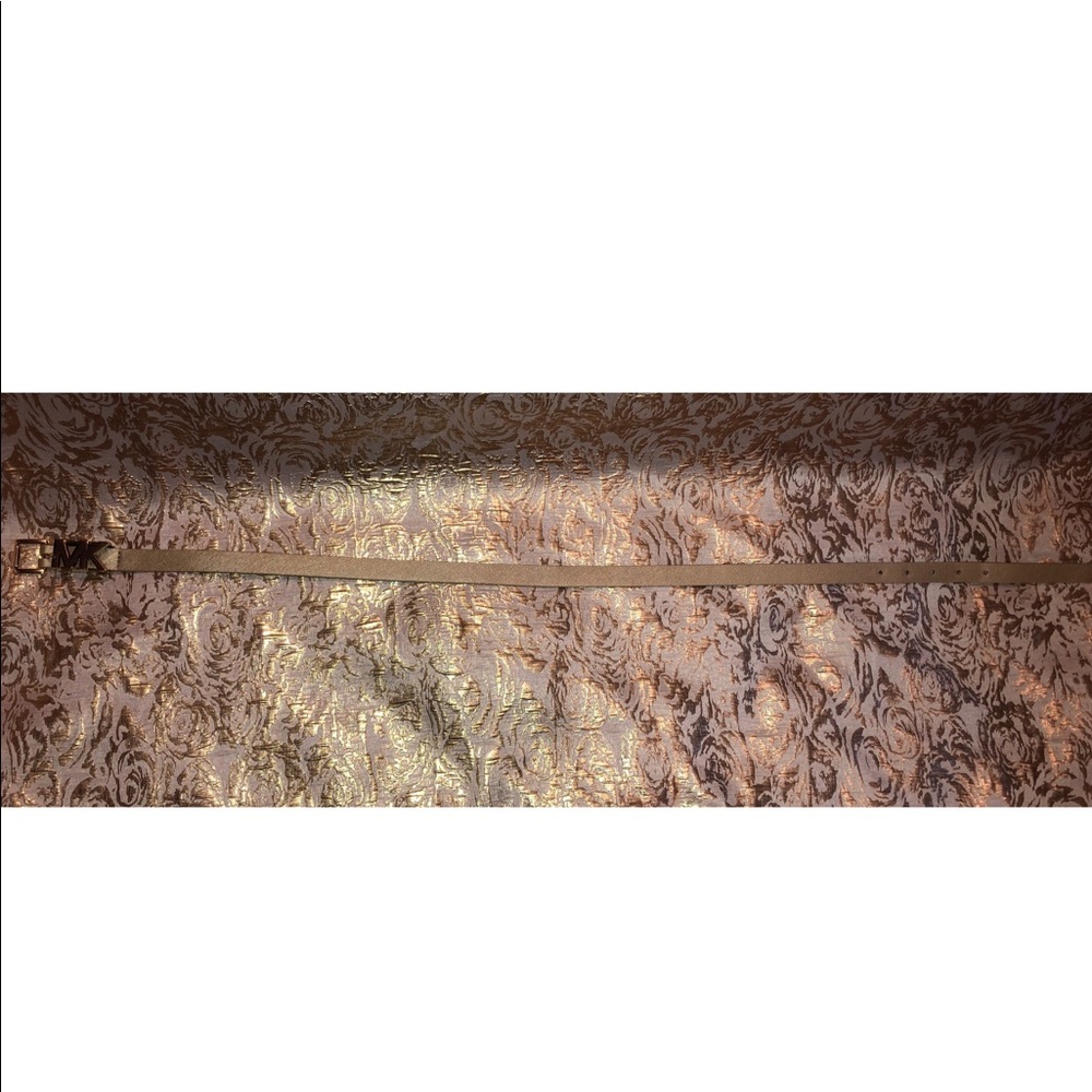 Gold MK belt.